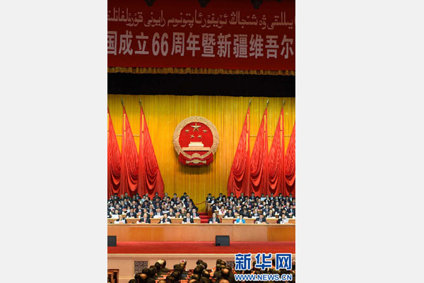 10月1日，慶祝中華人民共和國成立66周年暨新疆維吾爾自治區(qū)成立60周年大會(huì)在新疆人民會(huì)堂隆重舉行。 新華社記者 高潔 攝 